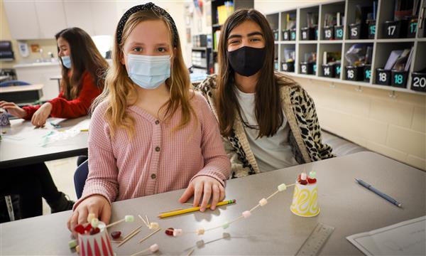 students work to build a bridge